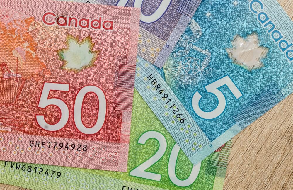 canadian dollar bills on table close up, USD/CAD